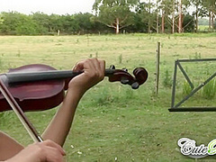 Cute rain strips off outdoors with violin