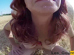 Slutty Redhead Milf Sucks In A Field With A Buttplug. Huge Facial Cumshot
