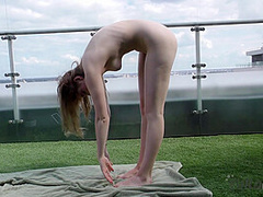 Gorgeous Model Margarita Tries Yoga While Nude On A Rooftop