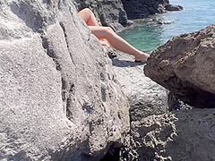 Gorgeous Readhed Fucked On The Beach Between The Rocks