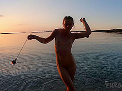 Hot Ginger Professional Fire Dancer Lea Playing With Her Flames On The Beach During Sunset