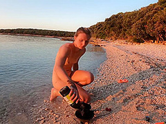 Hot Ginger Professional Fire Dancer Lea Playing With Her Flames On The Beach During Sunset