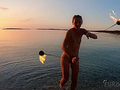Hot Ginger Professional Fire Dancer Lea Playing With Her Flames On The Beach During Sunset