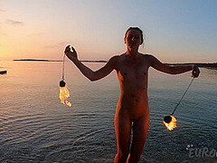 Hot Ginger Professional Fire Dancer Lea Playing With Her Flames On The Beach During Sunset