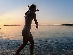 Hot Ginger Professional Fire Dancer Lea Playing With Her Flames On The Beach During Sunset