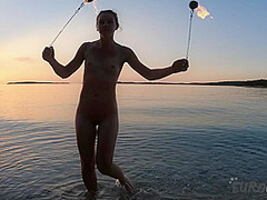 Hot Ginger Professional Fire Dancer Lea Playing With Her Flames On The Beach During Sunset