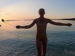 Hot Ginger Professional Fire Dancer Lea Playing With Her Flames On The Beach During Sunset
