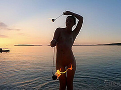 Hot Ginger Professional Fire Dancer Lea Playing With Her Flames On The Beach During Sunset
