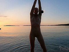 Hot Ginger Professional Fire Dancer Lea Playing With Her Flames On The Beach During Sunset