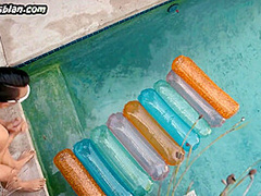 Tribbing lez babe licks Asian pussy outdoor on pool