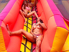 Horny Lesbians Fucking In A Bouncy Castle