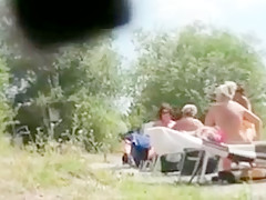 Matures suntanning naked