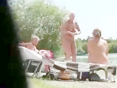 Matures suntanning naked