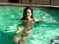 Beauty babe enjoys on swimming pool