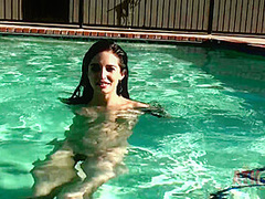 Beauty babe enjoys on swimming pool