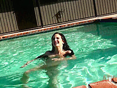 Beauty babe enjoys on swimming pool