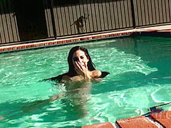 Beauty babe enjoys on swimming pool