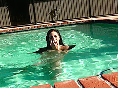 Beauty babe enjoys on swimming pool