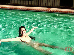 Beauty babe enjoys on swimming pool