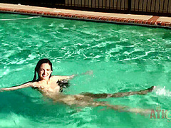 Beauty babe enjoys on swimming pool