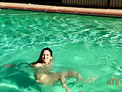 Beauty babe enjoys on swimming pool