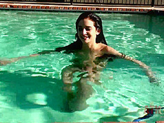 Beauty babe enjoys on swimming pool