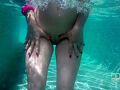 Natural Tits Superstar Teases With Cleavage in Pool - PornWorld
