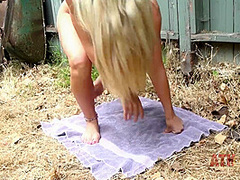 Kiarra Knight poses and pees outdoors