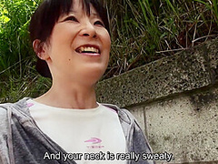 Sweaty older Japanese woman with massive tits uses them on my feet