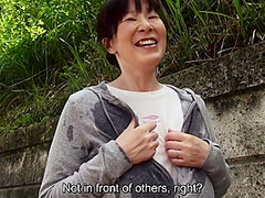 Sweaty older Japanese woman with massive tits uses them on my feet