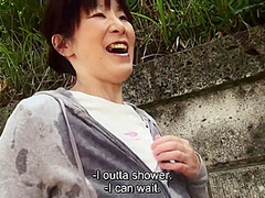 Sweaty older Japanese woman with massive tits uses them on my feet