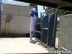 Little April rubbing her pussy at baseball field