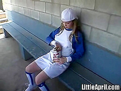 Little April rubbing her pussy at baseball field